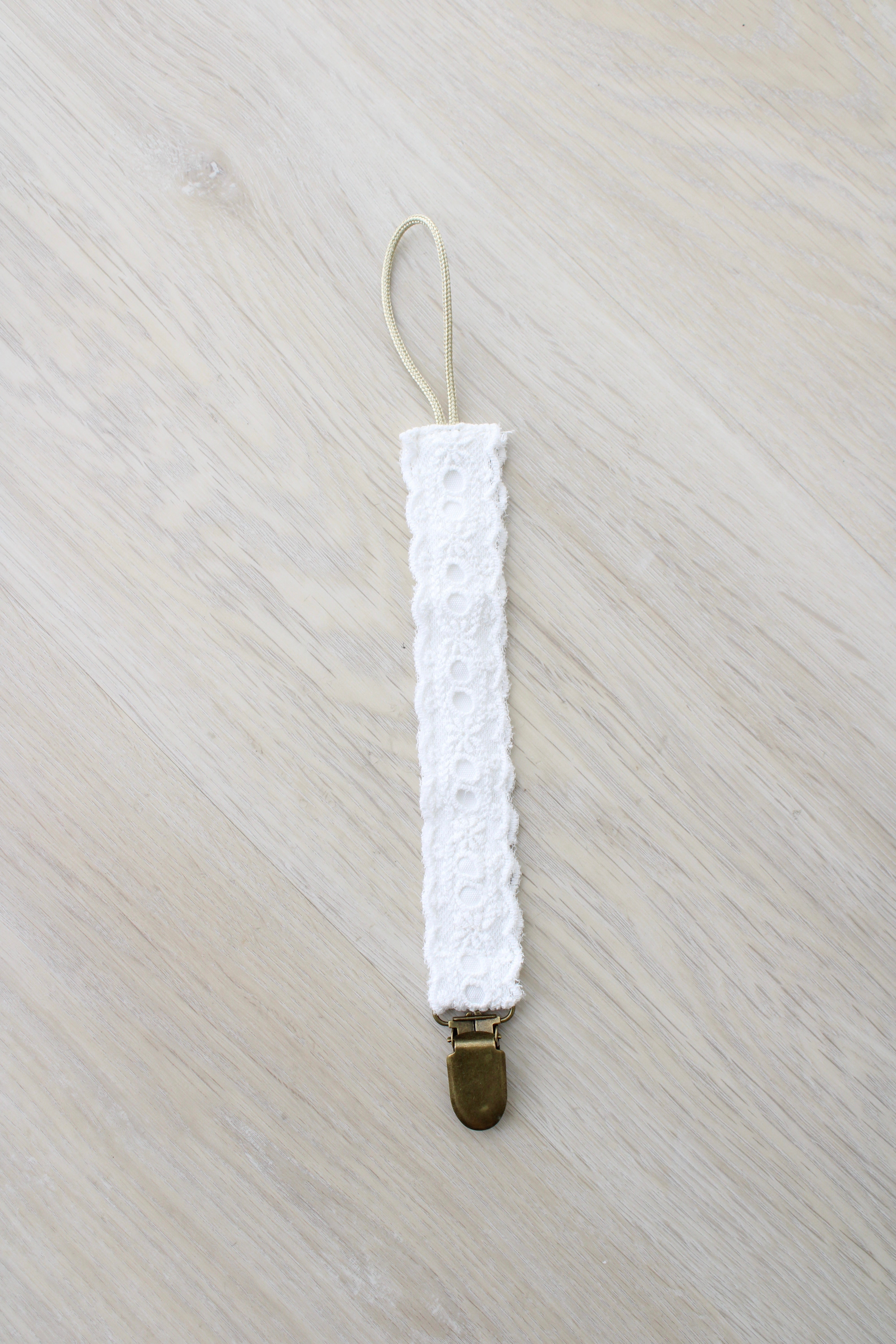White Eyelet Pacifier Clip